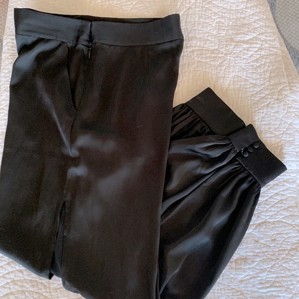 Marciano pants with high cut leg openings and ankle cuffs with covered buttons